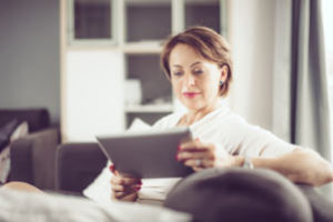 Lady searching online before buying an AC system.