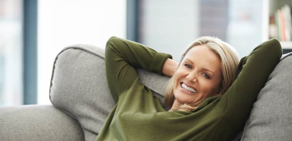 Lady feeling happy with central air conditioning