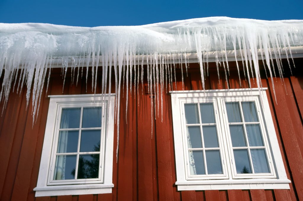 Ice dams on the roof of a house