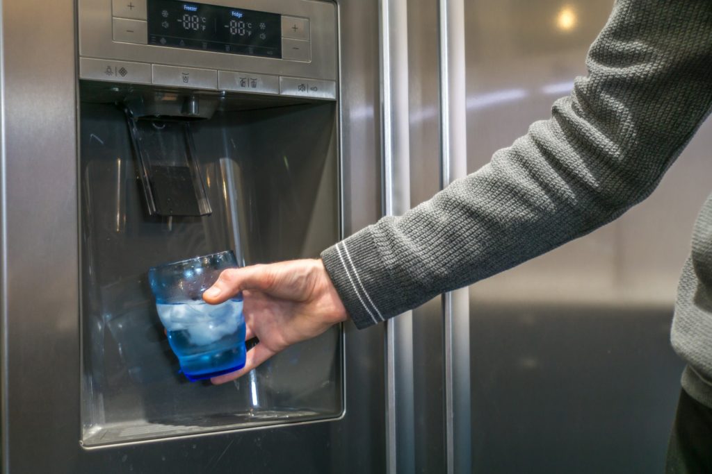 Fridge leaking water into a glass