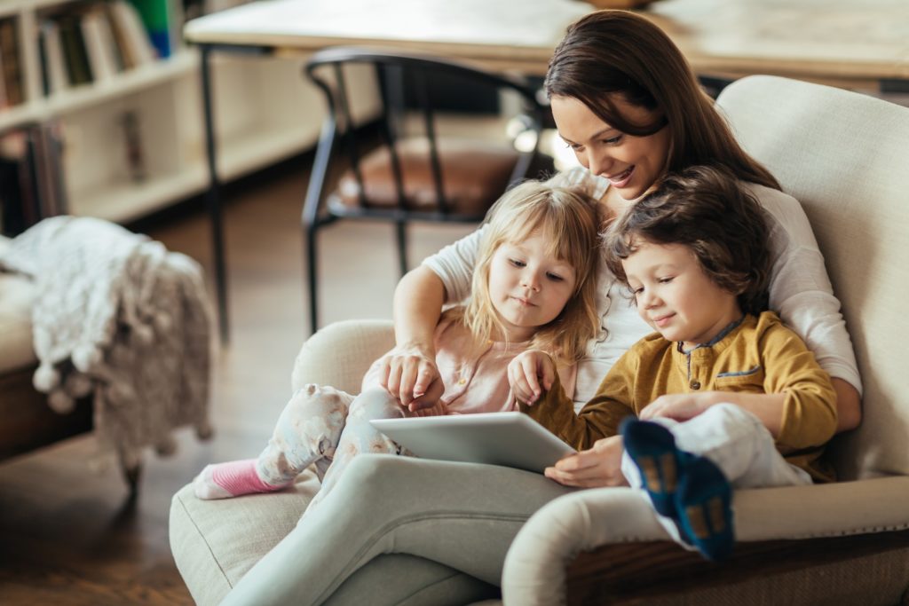 Mom with children in a warm room