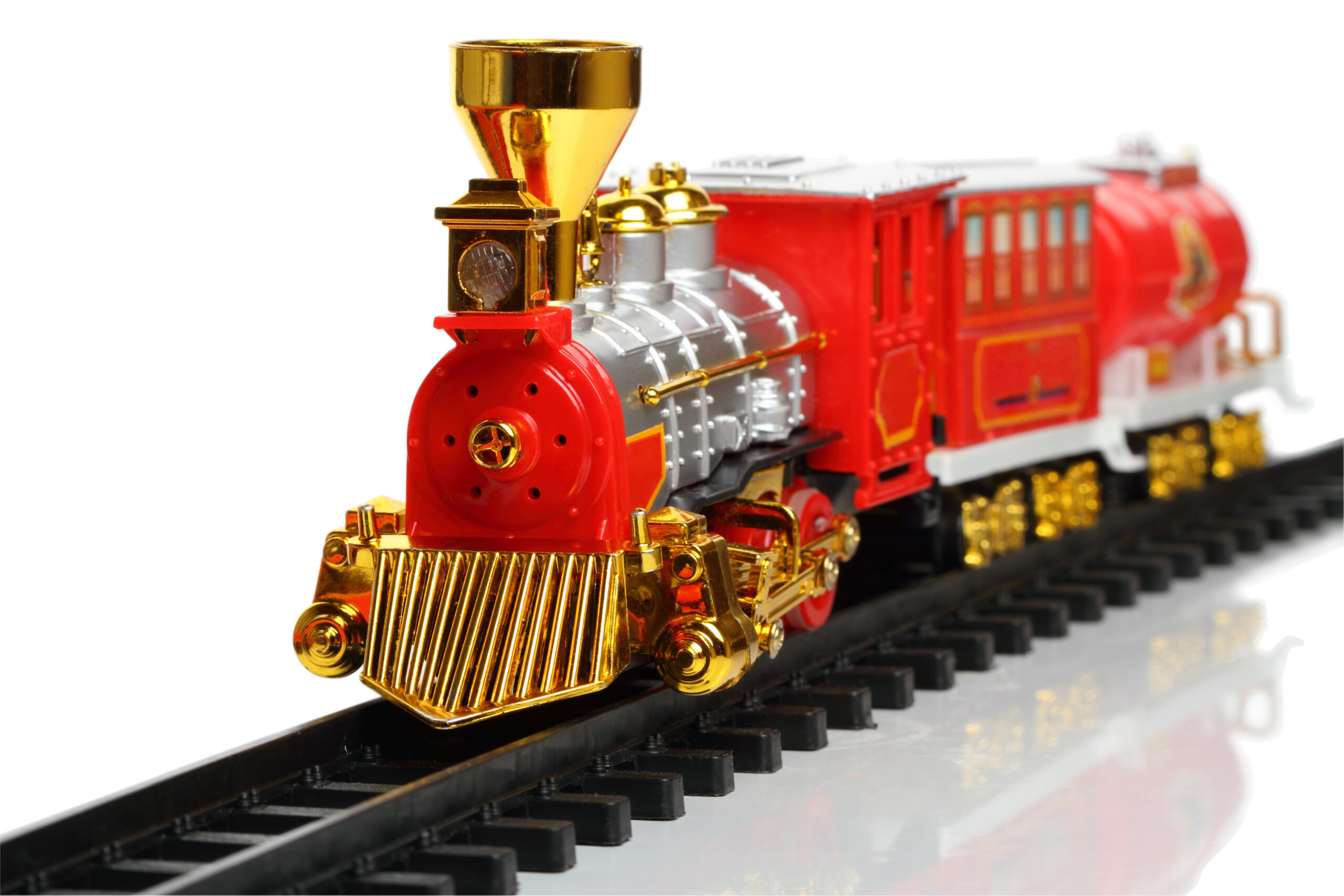 Miniature red and gold train on a track