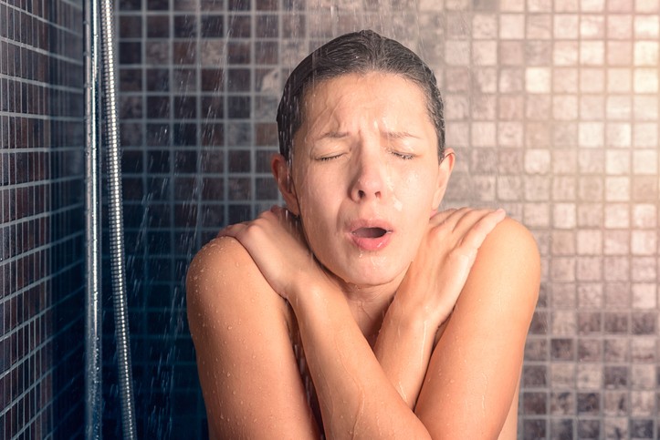 Girl enjoying a warm indoor bath with hot water